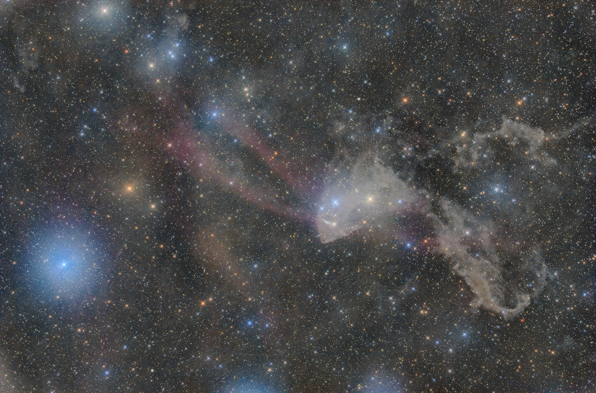 The large dust and emission nebula in the constellation Lacerta are cataloged under the name Sharpless 126 (Sh2-126). The dark nebula in the right part of the image has the shape of a lizard.